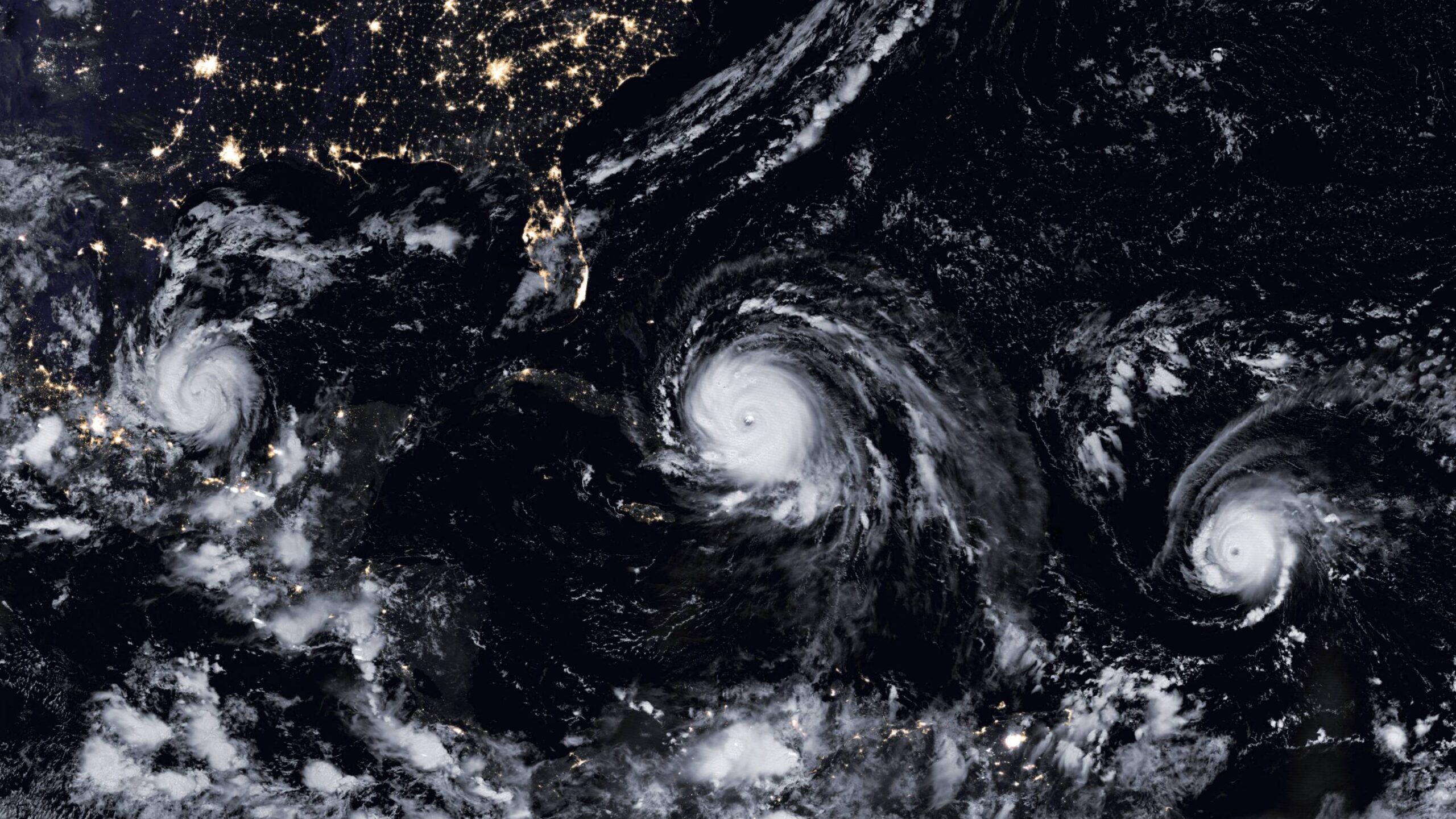 Princeton researchers explored the increasing risk of multiple destructive storms hitting locations on the Atlantic and Gulf coasts. In this image, three storms formed in the Atlantic basin in 2017. Photo by NASA
