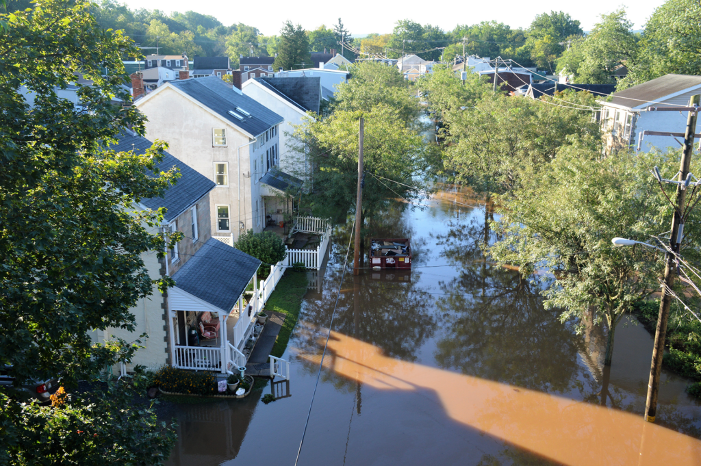 Image of flooding in town covering streets.